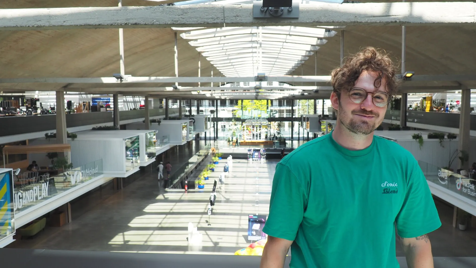 Quentin Sinig, founder of Looties, on the STATION F mezzanine above the Tech Merch Museum exhibition hall